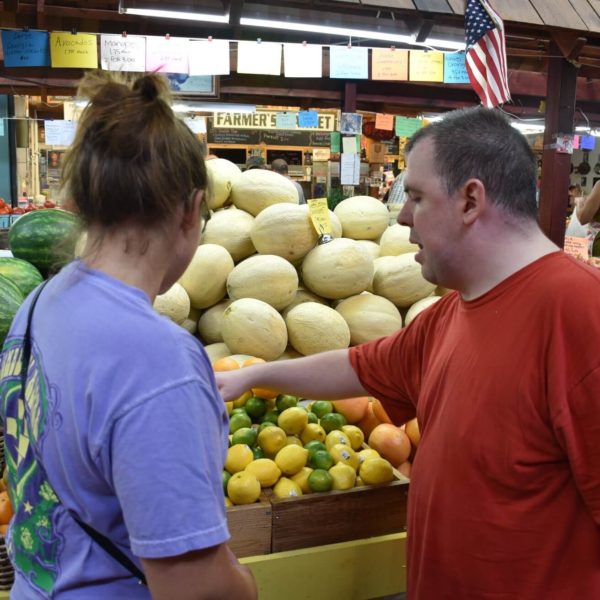 man shopping with staff