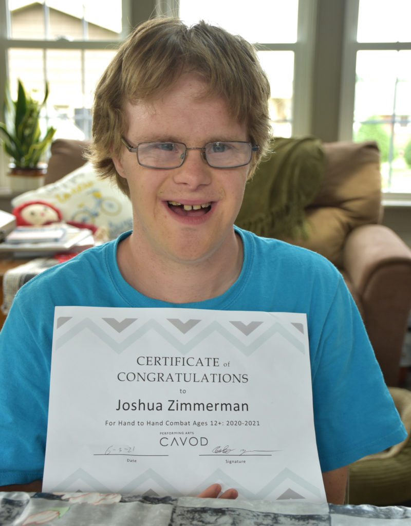 Josh with karate certificate