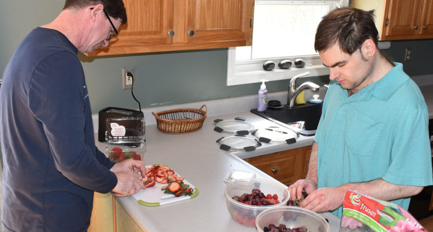 Christian and Matt prepping a fruit salad