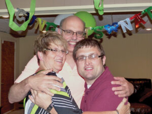 Nate celebrates Graduation Day with his parents