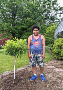 Adam Next to His Mother's Memorial